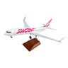 The Daron Swoop Boeing 737-800 1:100 Model features a white and pink livery, comes with a wooden display stand, and is perfect for collectors.