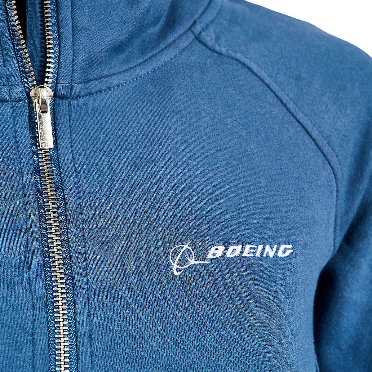 Close-up of the Glyder Boeing Womens Daily Quarter-Zip Pullover from The Boeing Store in blue, featuring a white embroidered Boeing logo on the chest and crafted from soft ISOSOF™ plush fabric.