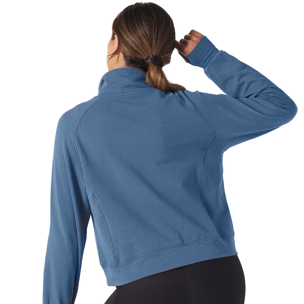A woman with brown hair in a ponytail, shown from the back raising her left arm and holding her hair, wears The Boeing Stores Glyder Boeing Womens Daily Quarter-Zip Pullover made from ISOSOF™ plush fabric and black leggings.