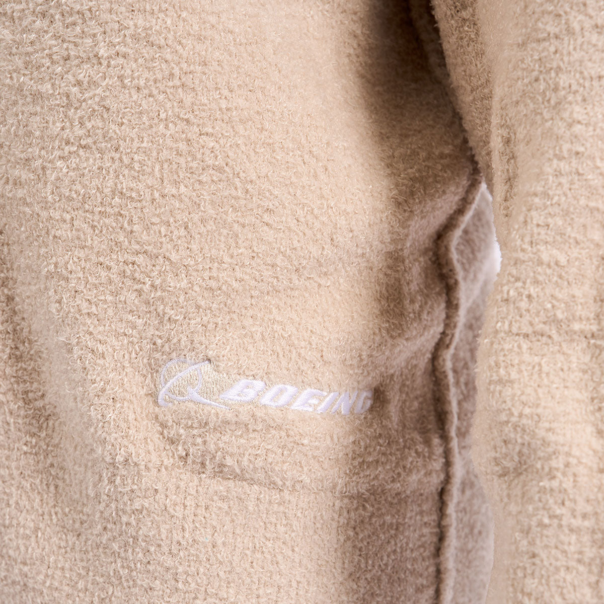 Close up image of Boeing logo on lower left hip area.