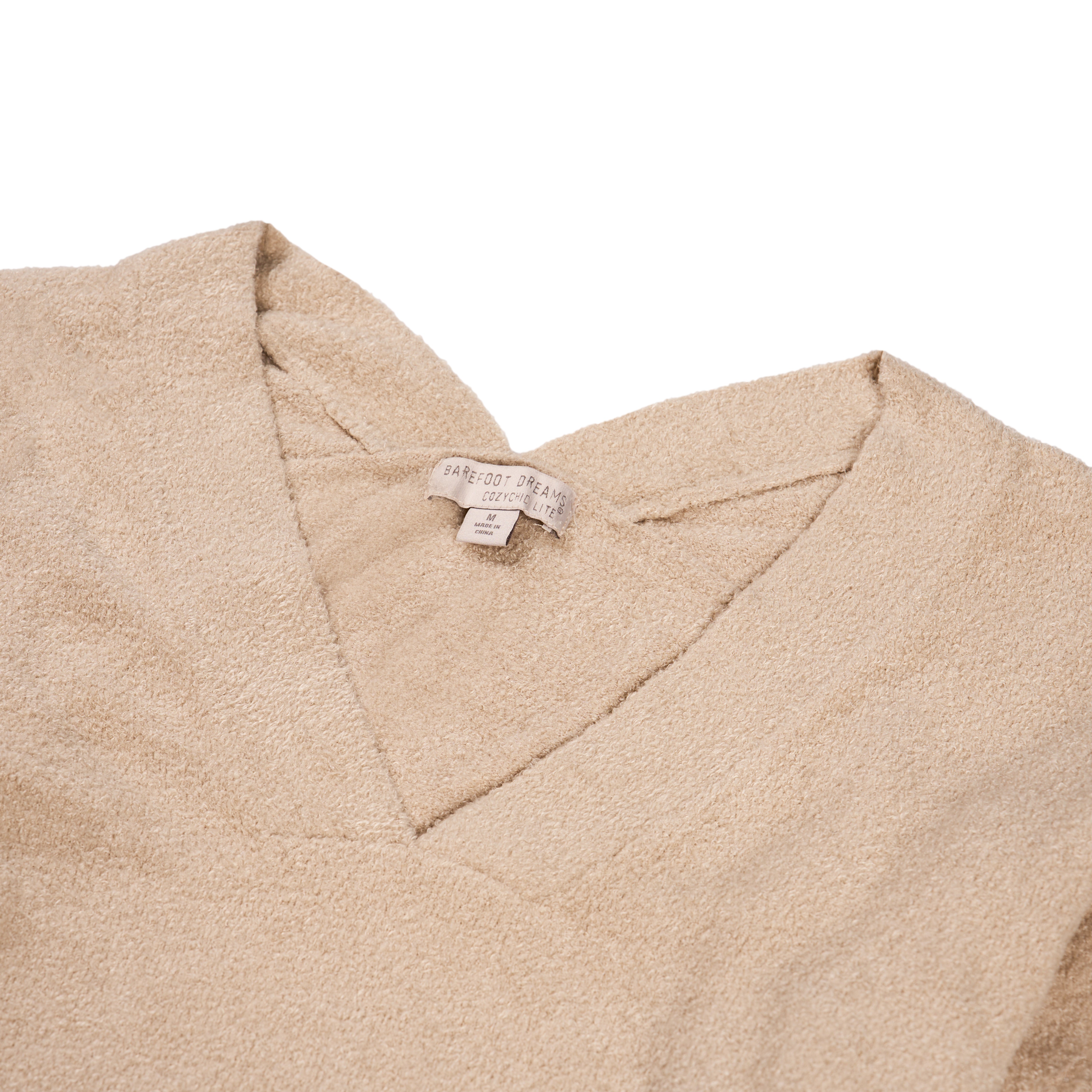 Close up of v-neck collar area.