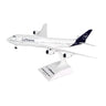 The Daron Lufthansa Boeing 747-8I 1:200 Model features Lufthansa branding, four engines, and a blue tail fin. Displayed on a stand labeled Lufthansa Boeing 747-8, its ideal for collectors and aviation enthusiasts.
