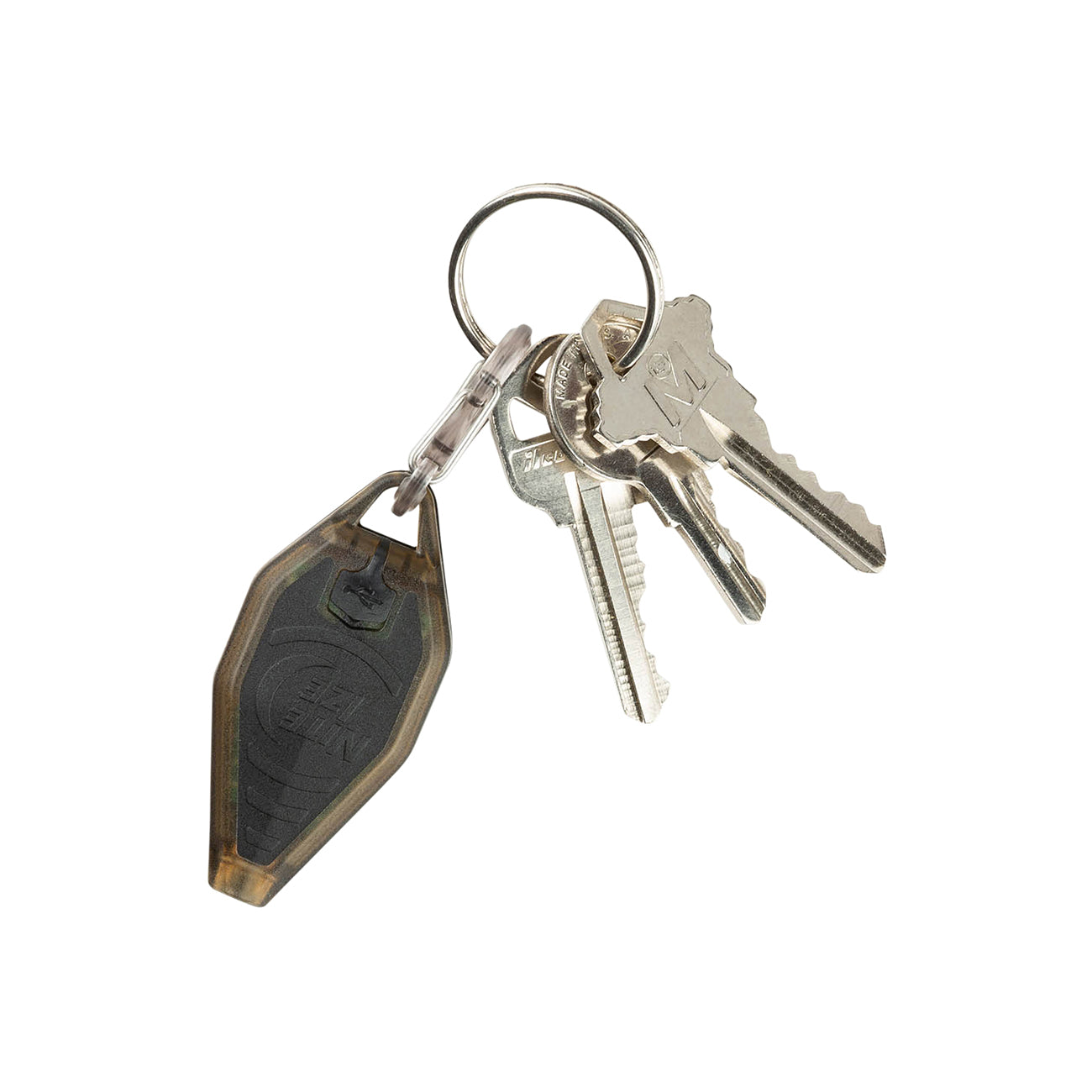 A circular keyring with metal keys is complemented by a Nite Ize Radiant Rechargeable Microlight from The Boeing Store, featuring a sleek black, shield-shaped keychain that serves as a compact lighting solution.