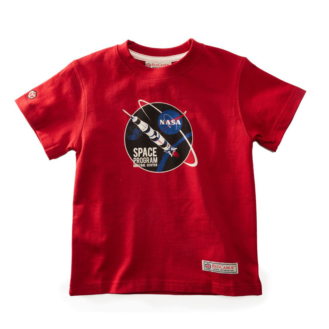 The Boeing Stores Red Canoe Boeing Kids NASA Space Program T-Shirt is 100% cotton, features a NASA graphic with a rocket and Earth on a black background, and has a small brand logo tag at the lower left.