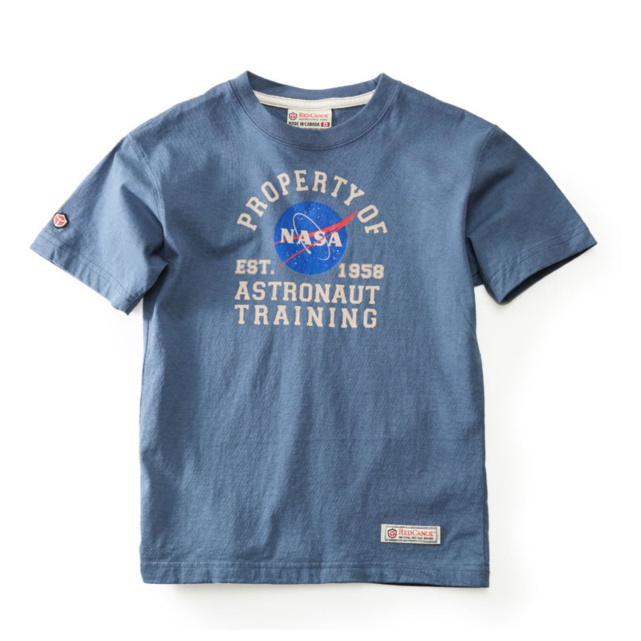 Red Canoe Boeing Kids NASA Astronaut T-Shirt by The Boeing Store features Property of NASA Astronaut Training text, the official logo, EST. 1958, and a sleeve patch, perfect for young space enthusiasts.