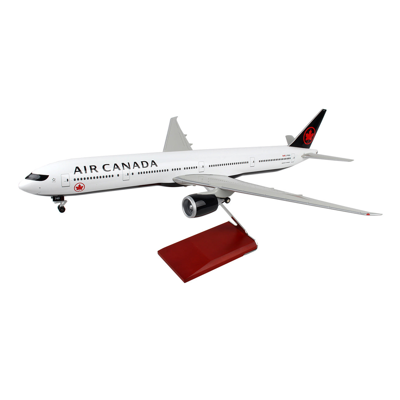 The Daron Air Canada Boeing 777-300 1:100 Model is an injection molded plastic aircraft with authentic markings and a sleek design. It features a red and white color scheme, a red base, extended wings, and a simplified Air Canada logo on the body and tail.