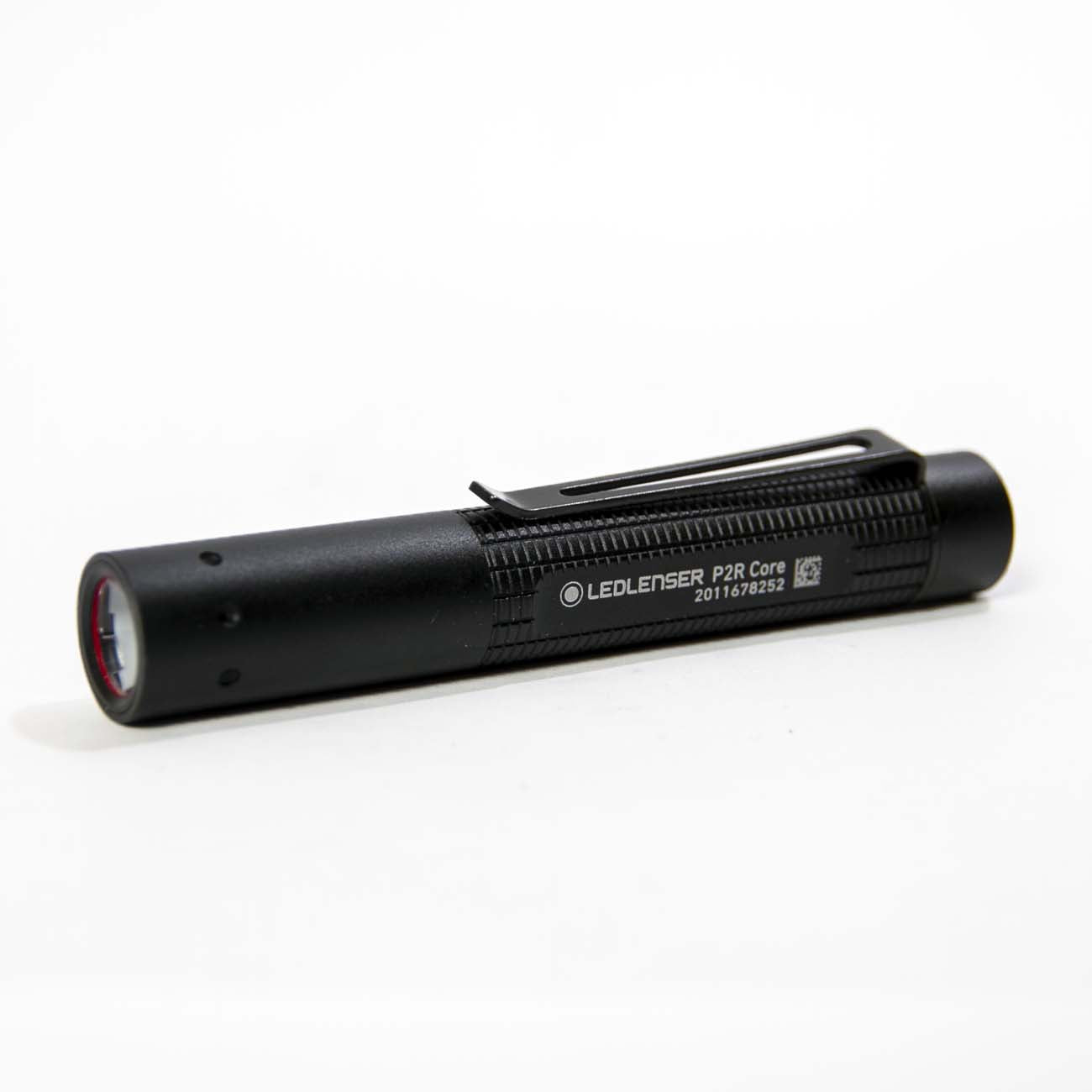 A Boeing Ledlenser P2R Core Flashlight from The Boeing Store, featuring a pocket clip, is shown in black, resting on a white surface and angled slightly to the left.