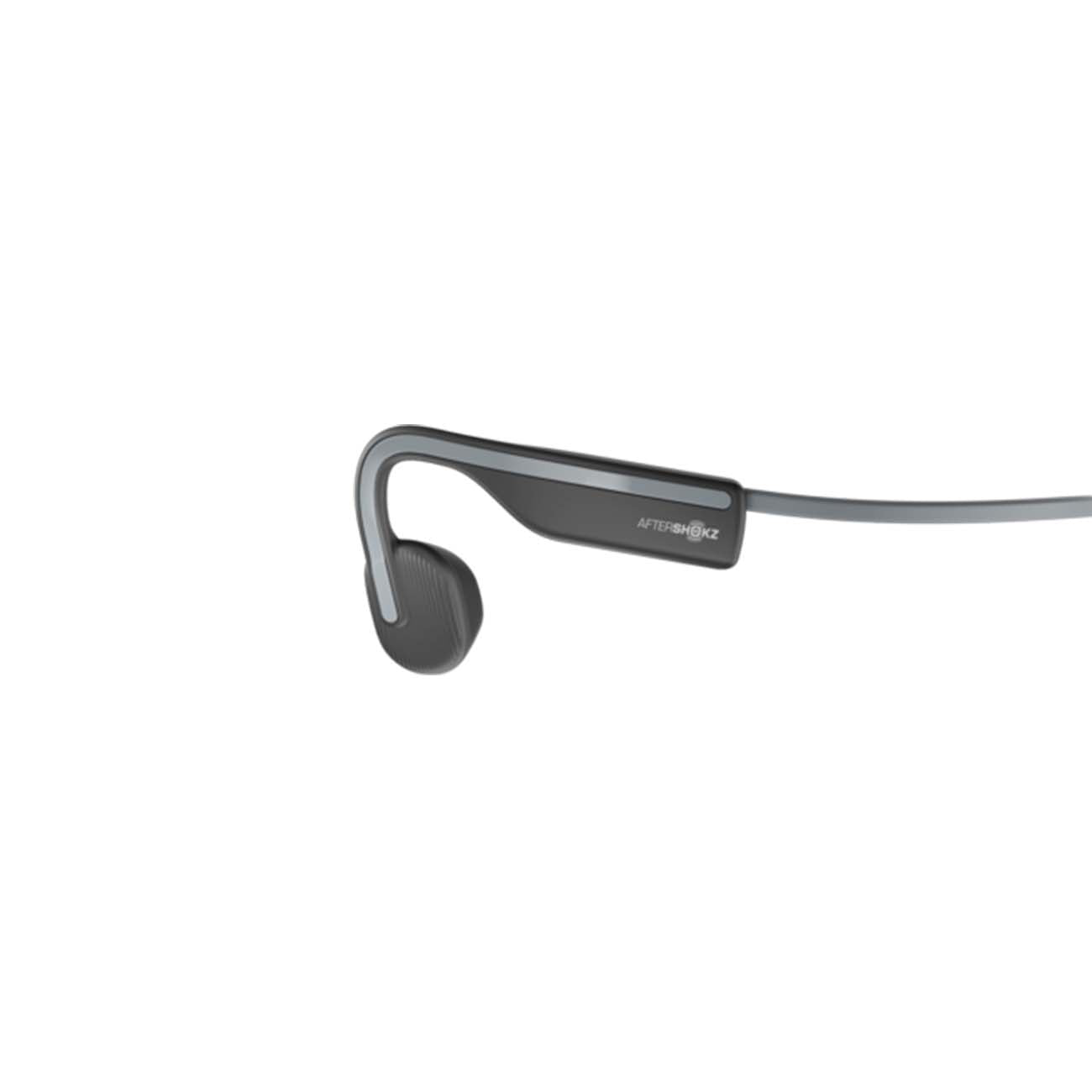 The Shokz™ OpenMove Headset by The Boeing Store features a sleek, minimalist design with open-ear bone conduction technology. It includes a small ear hook, a thin headband, Bluetooth v5.0, and comes in black and gray with a subtle logo for stylish and cutting-edge functionality.