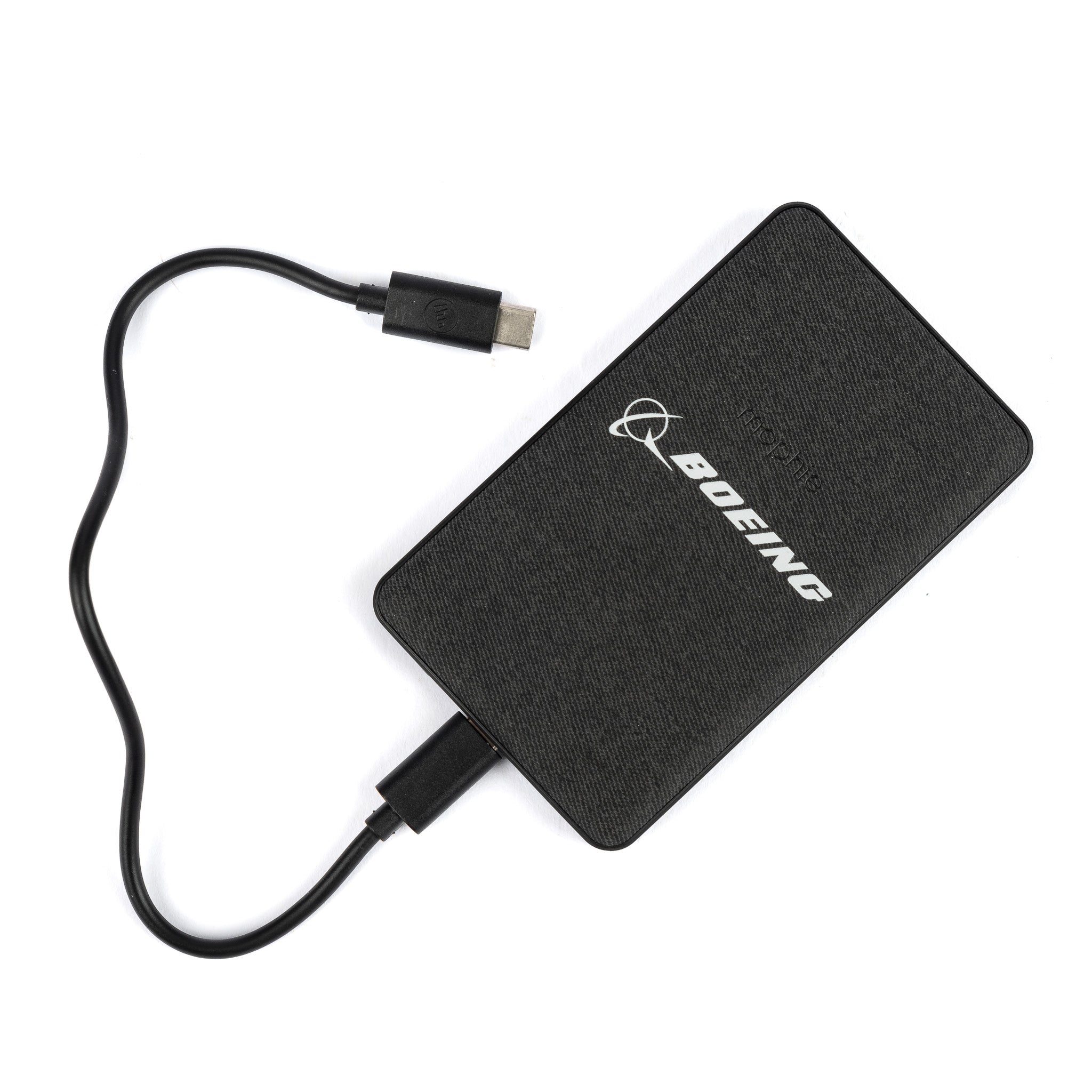 The Mophie Boeing Snap+ Juice Pack Mini Power Bank from The Boeing Store features a black rectangular design with a USB cable and Boeing logo in white, seamlessly pairing with existing gear like a magnetic wireless charger. The cable curves slightly against a white background.