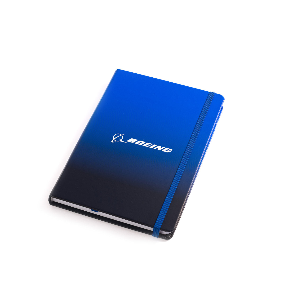 The Boeing Logo Notebook from The Boeing Store measures 5" x 7", has blue and black covers, an elastic band, white branding, and is made with wood-free paper. It is shown on a white background.