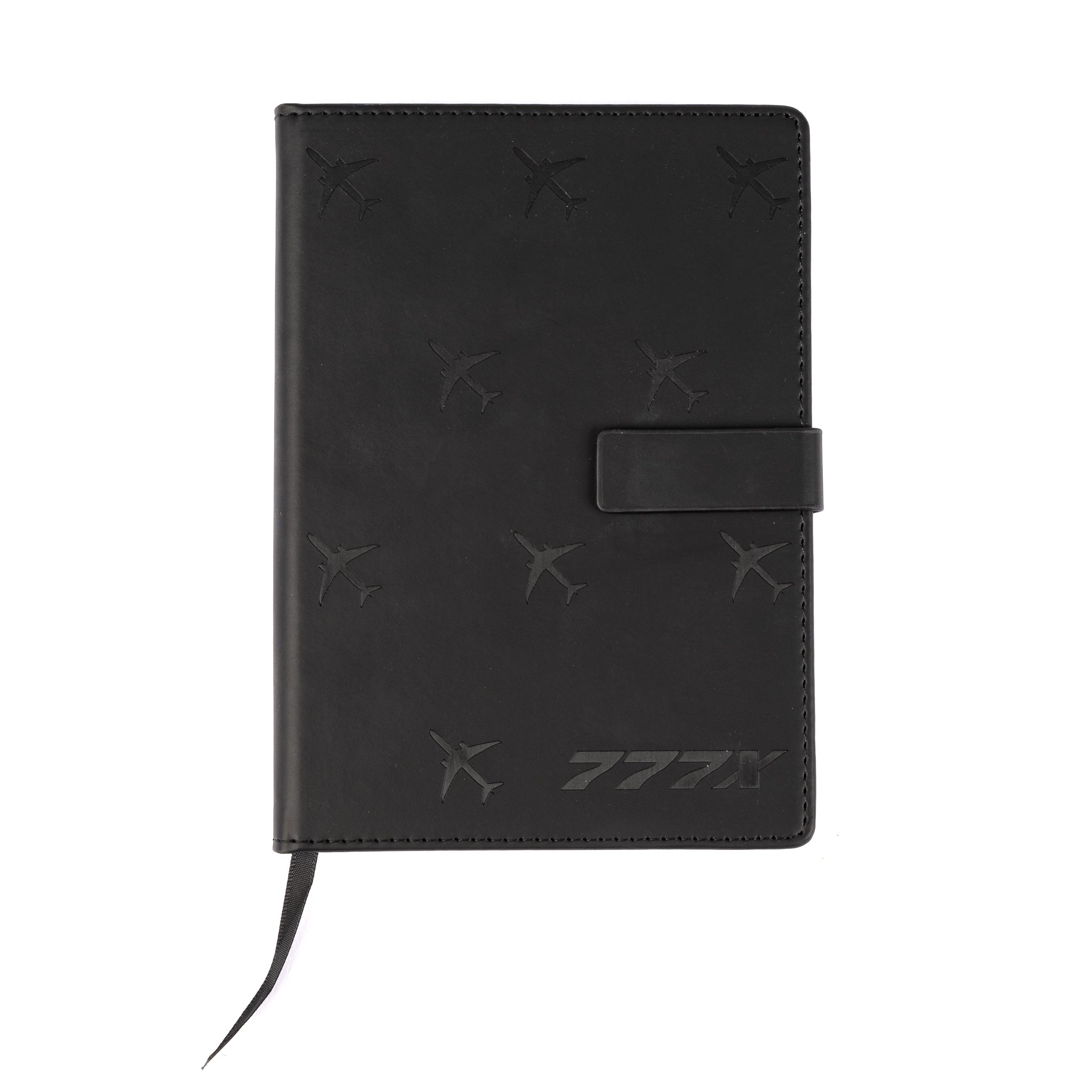 The Boeing 777X Notebook from The Boeing Store is a black leather notebook with embossed aircraft silhouettes, a magnetic clasp, ribbon bookmark, and a stylized logo with Japanese katakana on the bottom right corner.