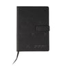 The Boeing 777X Notebook from The Boeing Store is a black leather notebook with embossed aircraft silhouettes, a magnetic clasp, ribbon bookmark, and a stylized logo with Japanese katakana on the bottom right corner.
