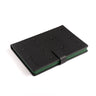 The Boeing Stores Boeing CH-47 Chinook Notebook is a black PU leather notebook with embossed star patterns and CH-47 text, featuring a green interior like Boeing aircraft, and a black strap closure, angled on a white background.
