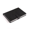 The Boeing Stores P-8 Poseidon Notebook features a sleek black textured cover embossed with P-8A, a strap closure, and raised X-shaped marks inspired by aircraft design. Edges elegantly reveal the pages.