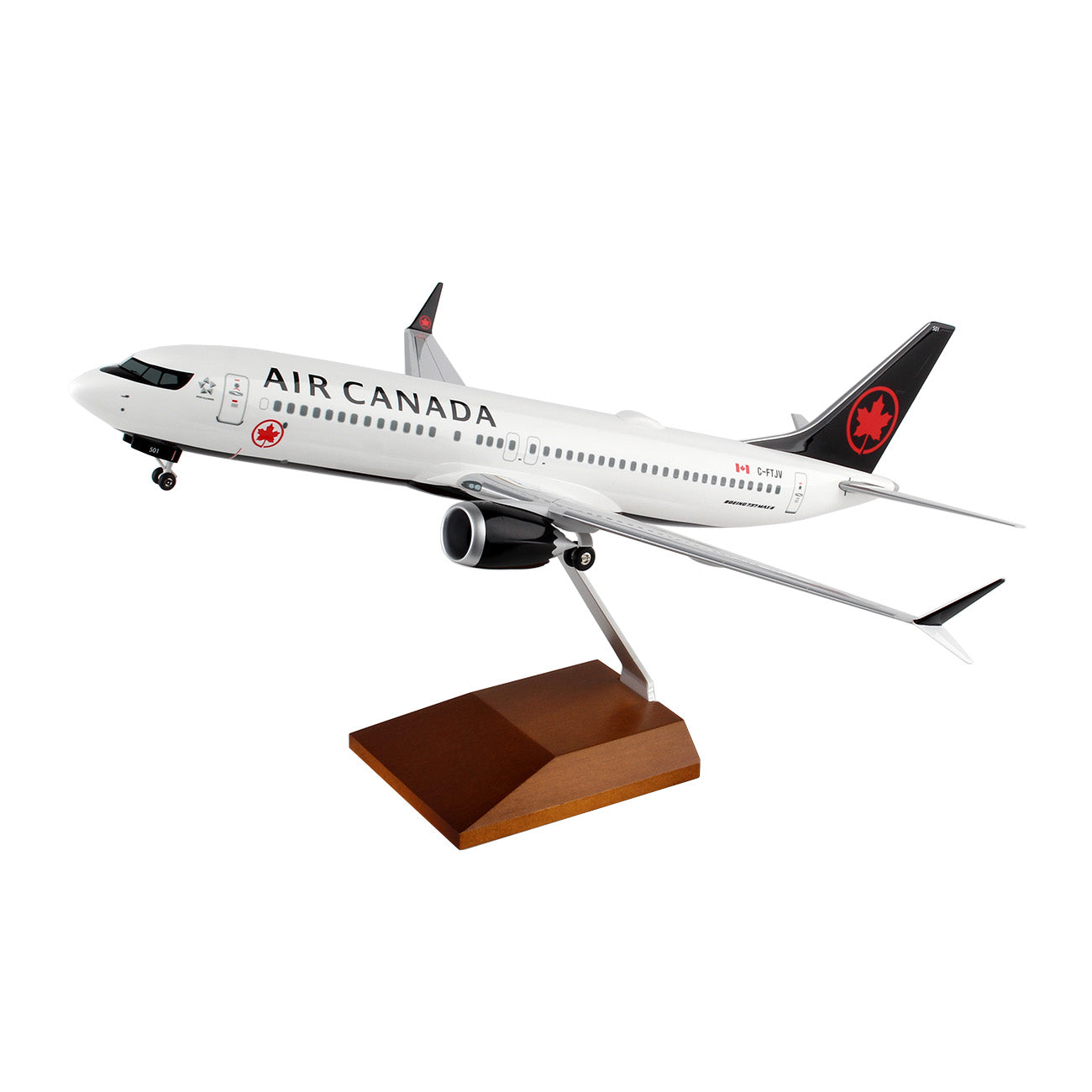 The Daron Air Canada Boeing 737 MAX 8 1:100 Model features detailed graphics, the Air Canada logo, and a white fuselage with black accents on the tail and engines. It comes mounted on a wooden display stand for collectors.
