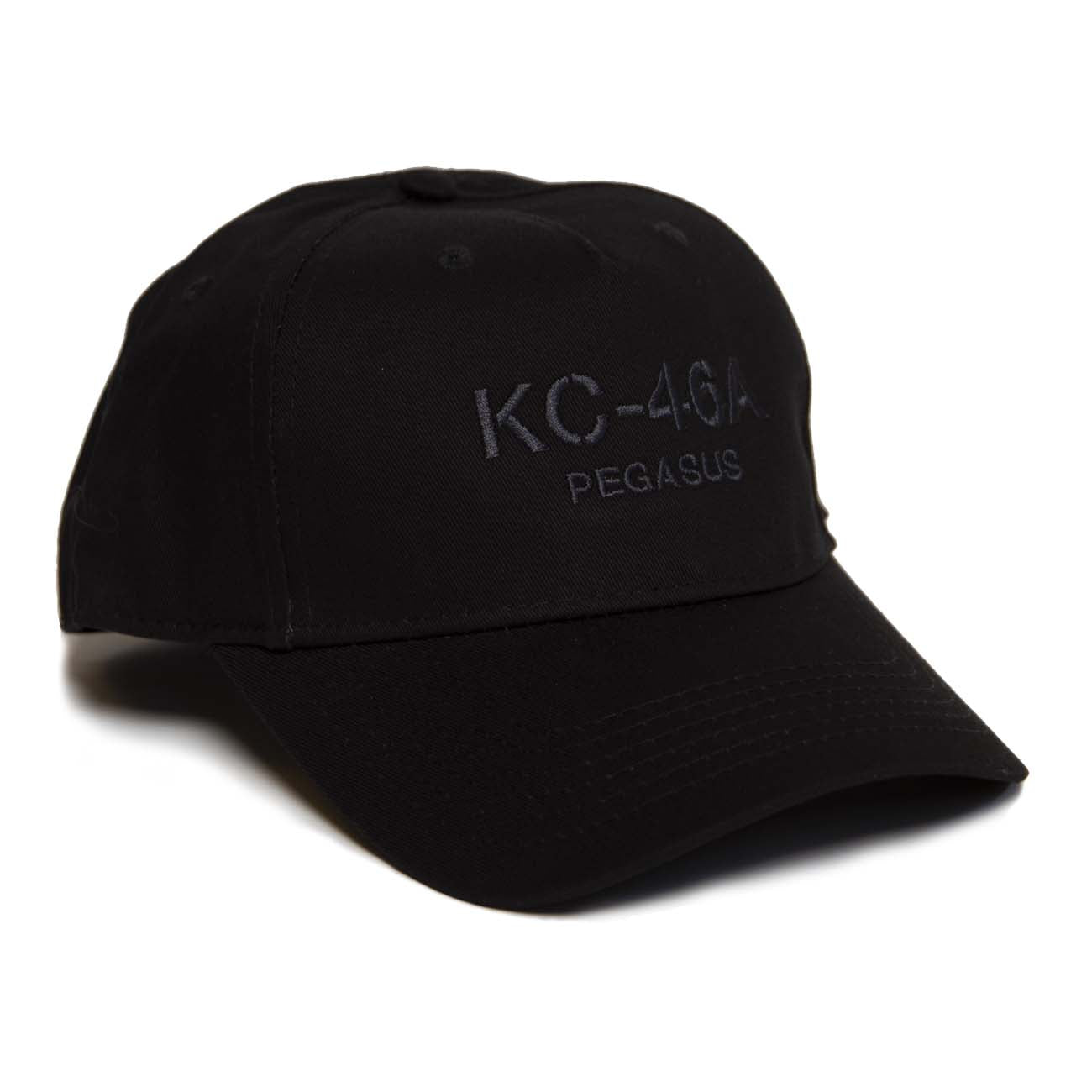 The Boeing Stores Boeing KC-46 Hat is a black, 100% cotton baseball cap featuring KC-46A PEGASUS embroidered on the front in dark gray. It has a mid-profile curved brim and six stitched ventilation holes for comfort.