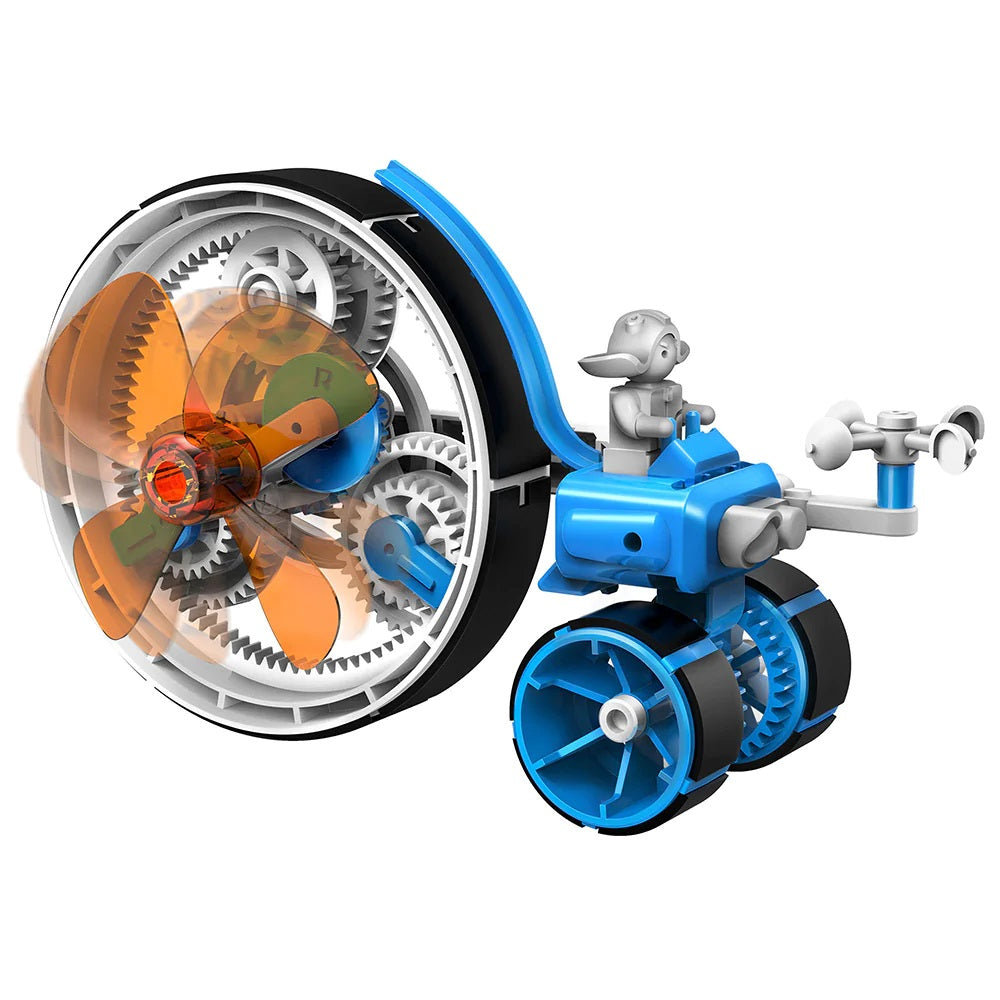 The Boeing Store Thames & Kosmos Windbots is a blue and white wind-powered toy vehicle with large exposed gears, a spinning orange fan, and bike-like handlebars. Includes a small robot figure on top—no batteries needed; perfect for kids’ engineering fun.