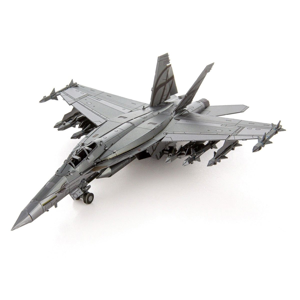 The Boeing Store’s Metal Earth Boeing F/A-18 Super Hornet is a gray model of the famous U.S. Navy fighter jet, featuring twin tails and detailed missiles, shown on a white background.