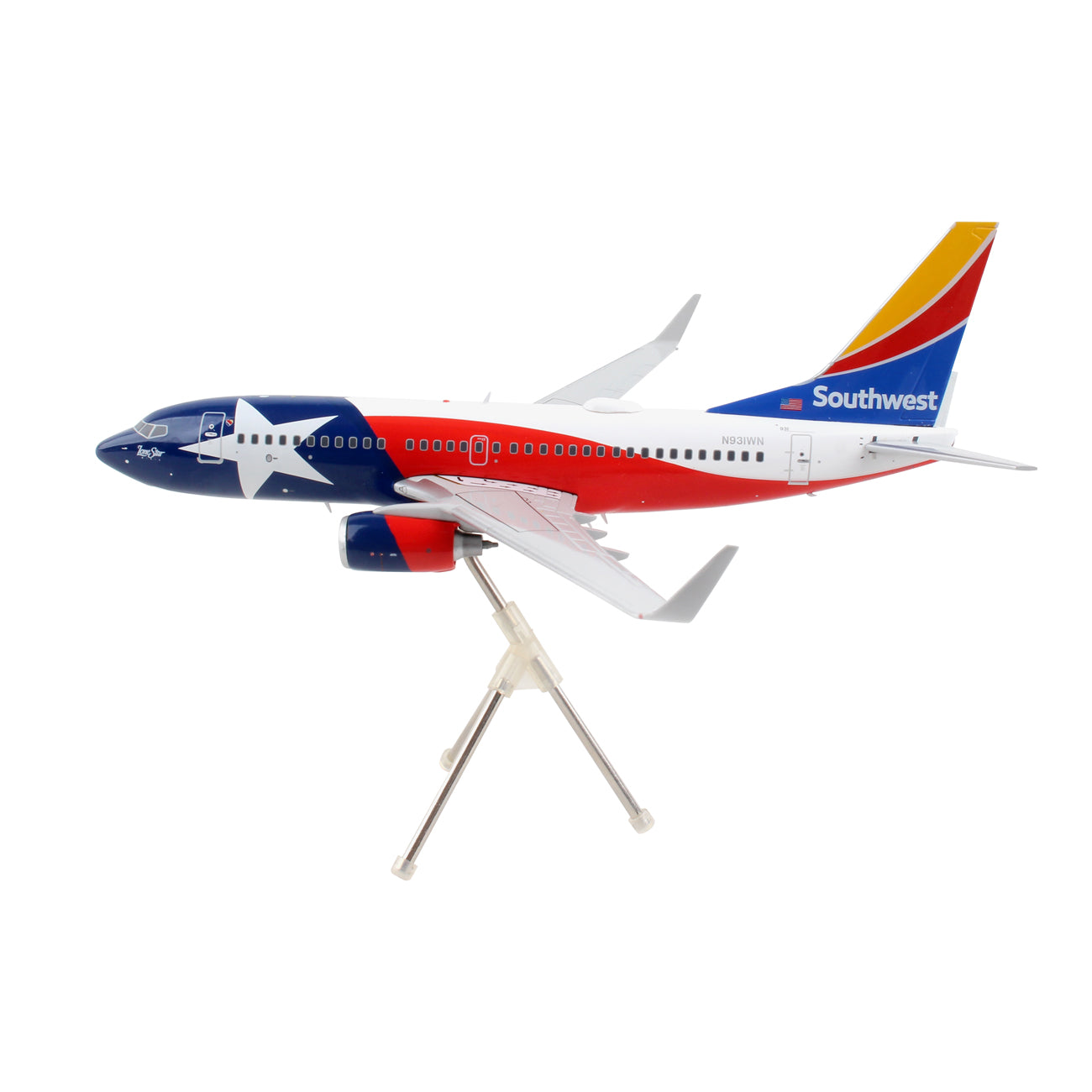 The Daron Southwest Airlines Boeing 737-700 1:200 model is a die-cast metal replica with red, blue, and white paint featuring a star design and detailed landing gear, elegantly displayed on a stand.