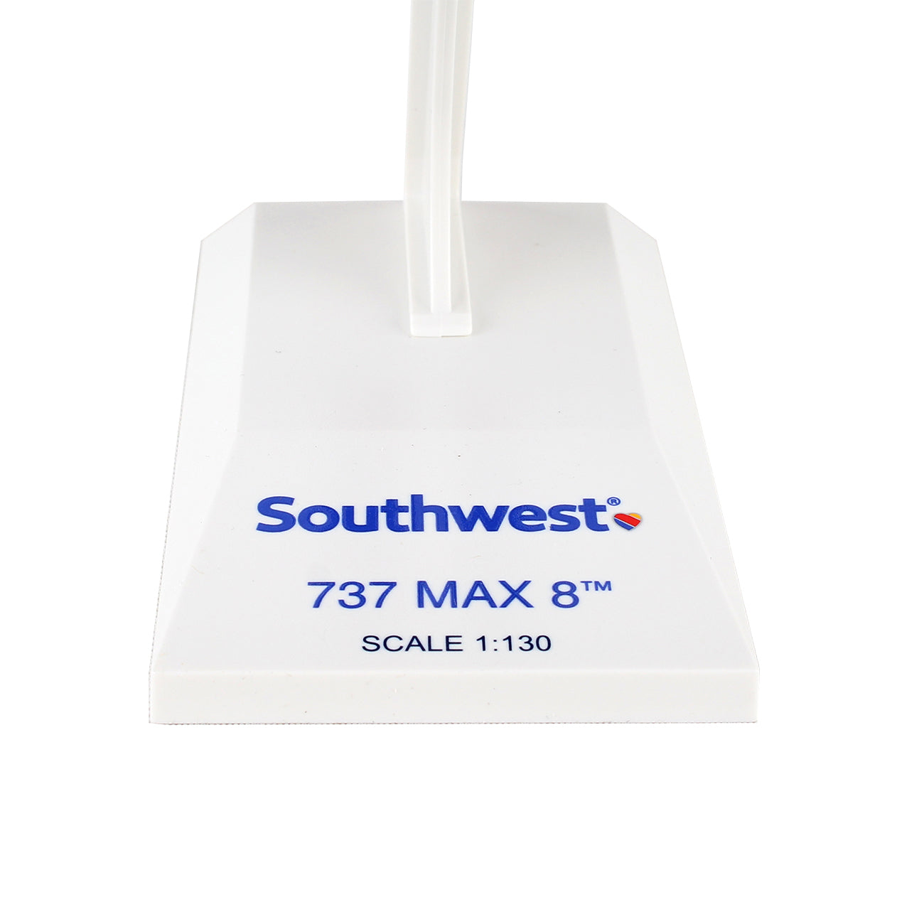 The Daron Southwest Airlines Boeing 737 MAX 8 1:130 Model is a precision-injection molded plastic stand with blue text, showcasing the iconic Southwest logo. Perfect for collectors.