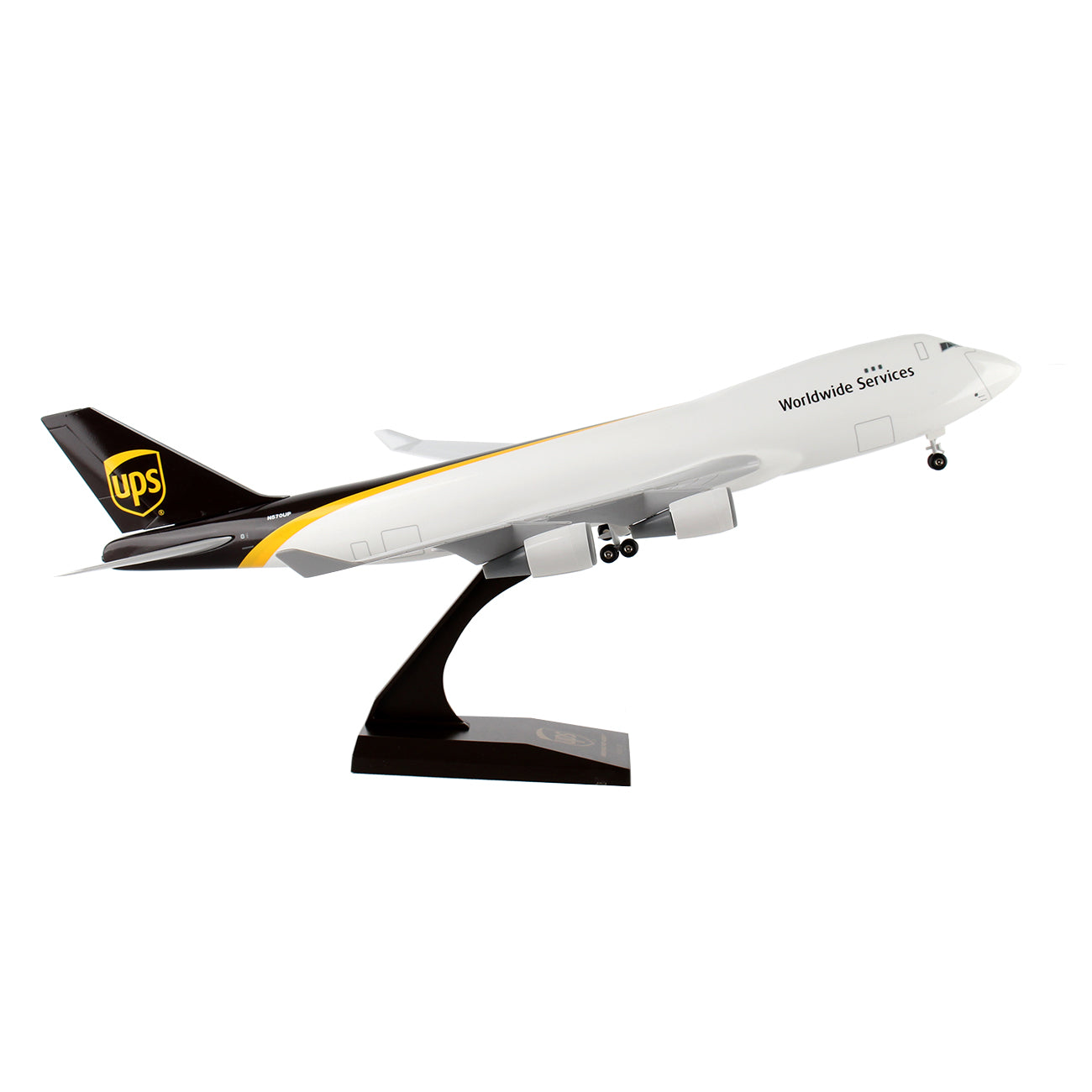The Daron UPS Boeing 747-400F 1:200 Model is meticulously crafted from injection-molded plastic. It features a white body with a distinctive yellow and brown tail stripe displaying the UPS logo, showcasing an upward tilt to capture the essence of takeoff.