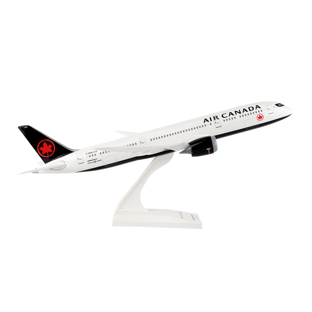 The Daron Air Canada Boeing 787-9 2017 1:200 Model sits on a white stand in mid-flight position, featuring detailed graphics with black and red accents, including a red maple leaf logo on the tail—an ideal collectors piece showcasing a passenger aircraft.