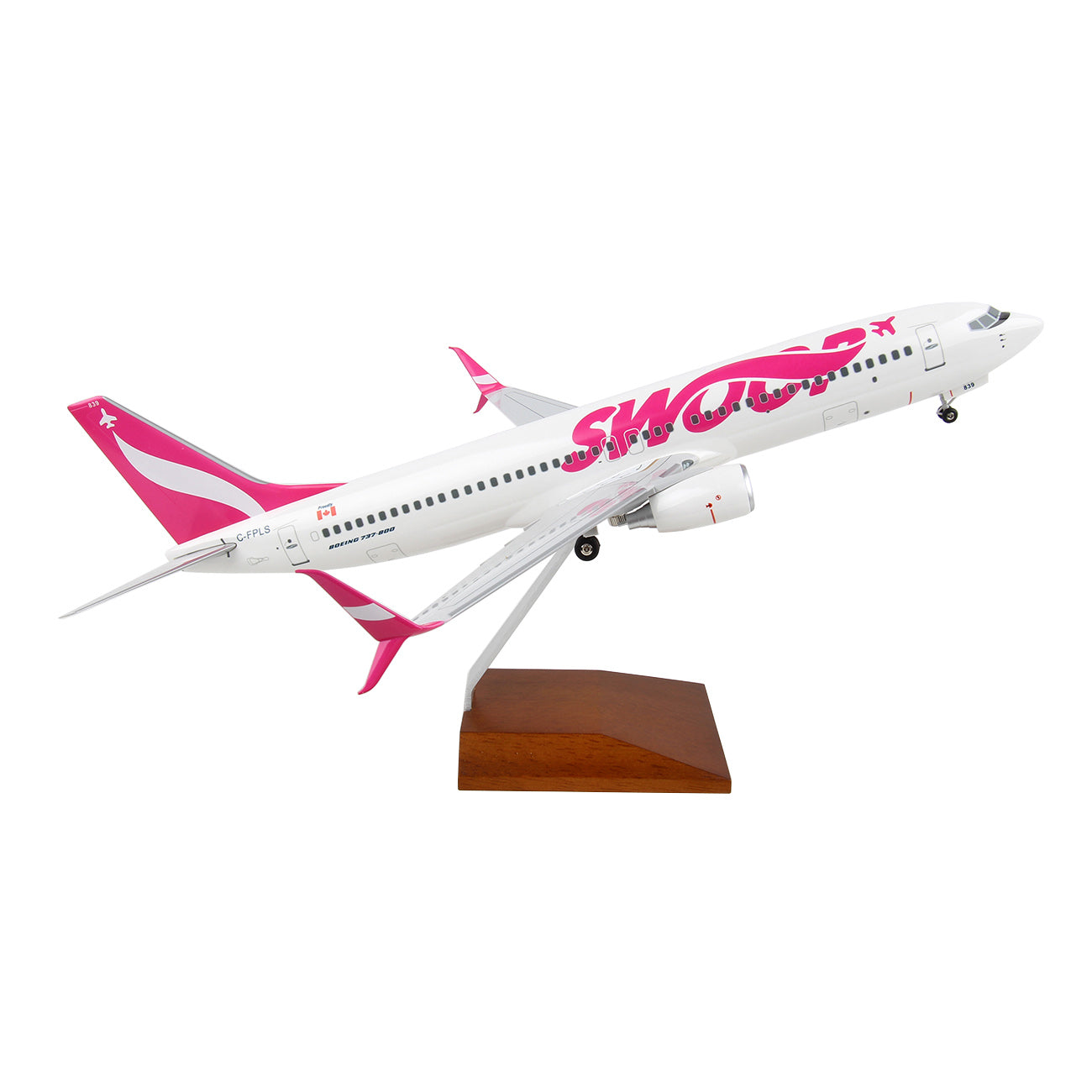 The Daron Swoop Boeing 737-800 1:100 Model features a white body with pink accents and Swoop displayed on the side. Mounted on a wooden stand, this collectible is shown against a plain white background.