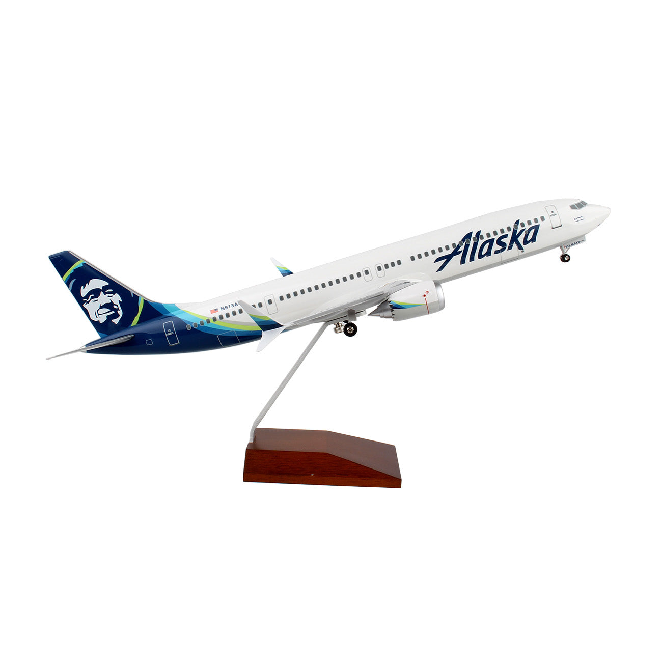 The Daron Alaska Airlines Boeing 737 MAX 9 1:100 Model features the airline’s logo and blue-green tail, mounted on a wooden stand in a takeoff pose. A perfect collectible for aviation fans. Assembly required.