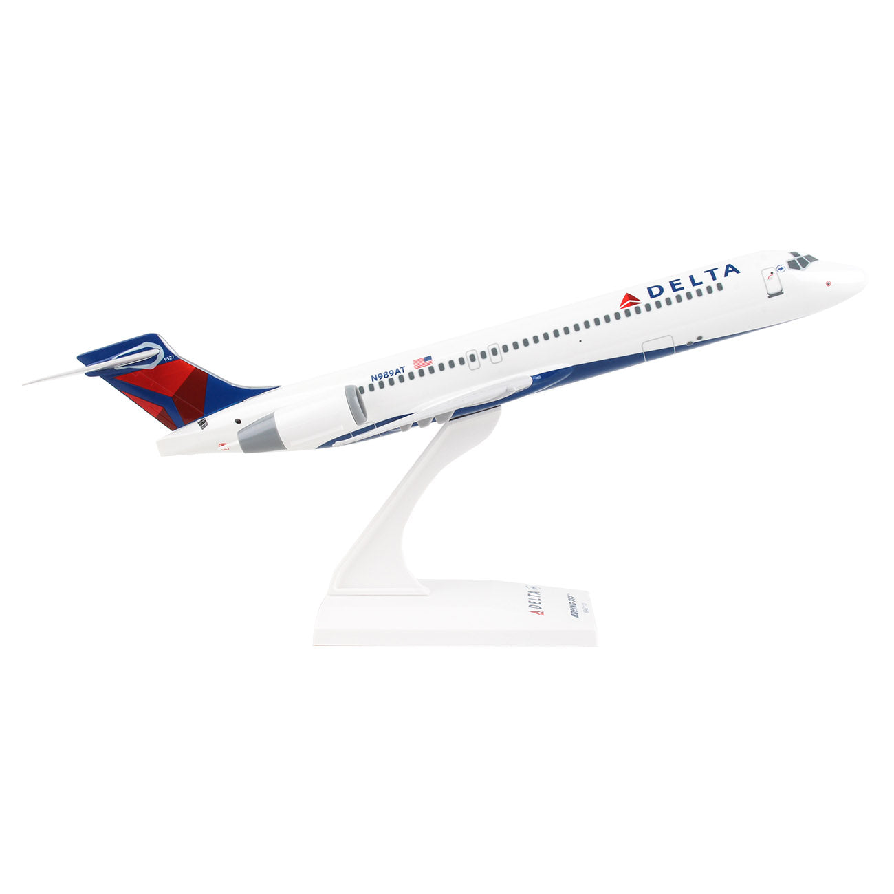 The Boeing Stores Delta Air Lines Boeing 717 1:130 Model features a white body with blue and red tail fin, angled upward on its display stand to highlight its Delta logo and colors. This collectors item may require some assembly to showcase its iconic design.