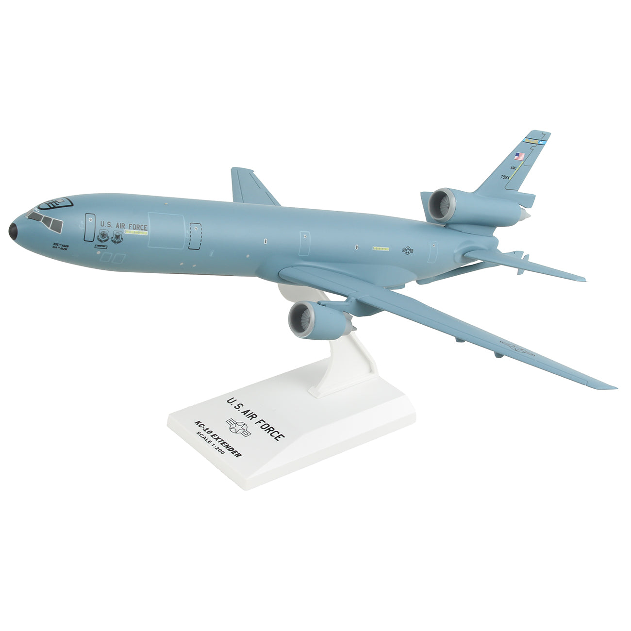 The Daron Boeing KC-10 USAF McGuire Air Force Base 1:200 Model is ideal for collectors, featuring a gray aircraft with two engines on the wings and one on the tail, displayed on a white base labeled U.S. Air Force KC-10A Extender McDonnell Douglas.