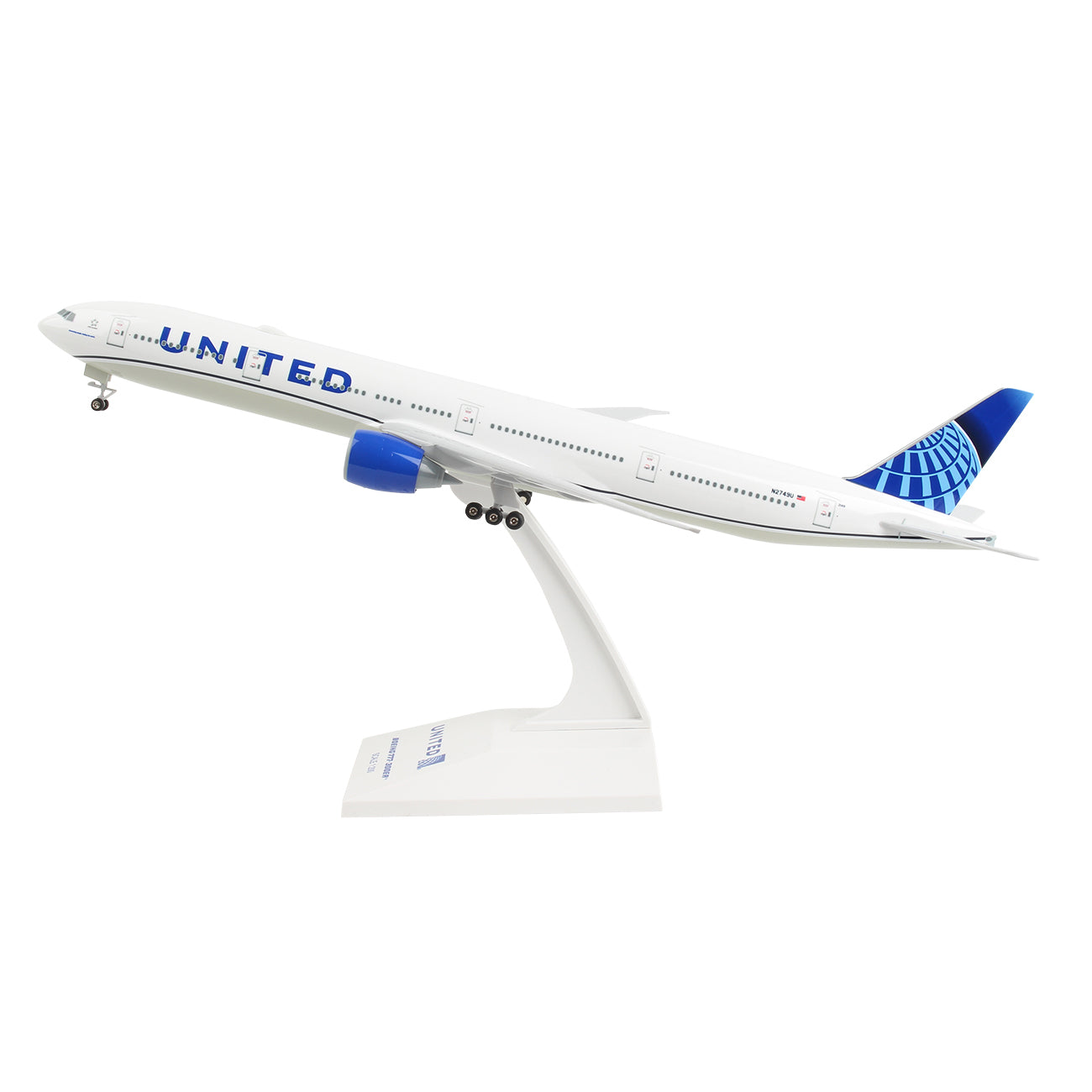 The Daron United Airlines Boeing 777-300 1:200 model features detailed graphics, a snap-fit design, UNITED in large blue letters on the fuselage, and a blue patterned tail as seen in takeoff position on a white display stand.