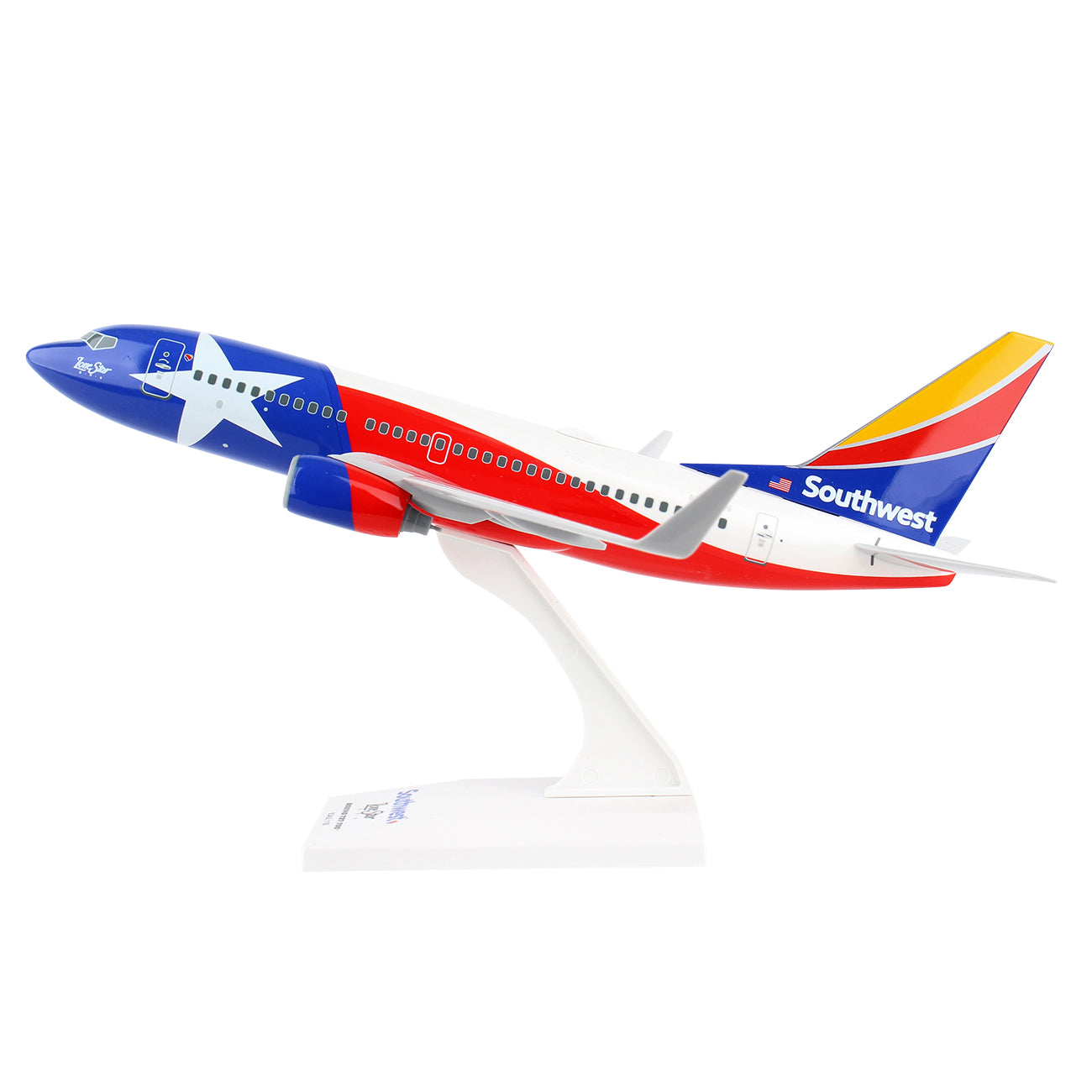 This Daron collectible model of a Southwest Airlines Boeing 737-700 Lonestar features a Texas-themed design with the flag and star. It includes a snap-fit assembly on a white stand, ideal for collectors seeking charm and precision.