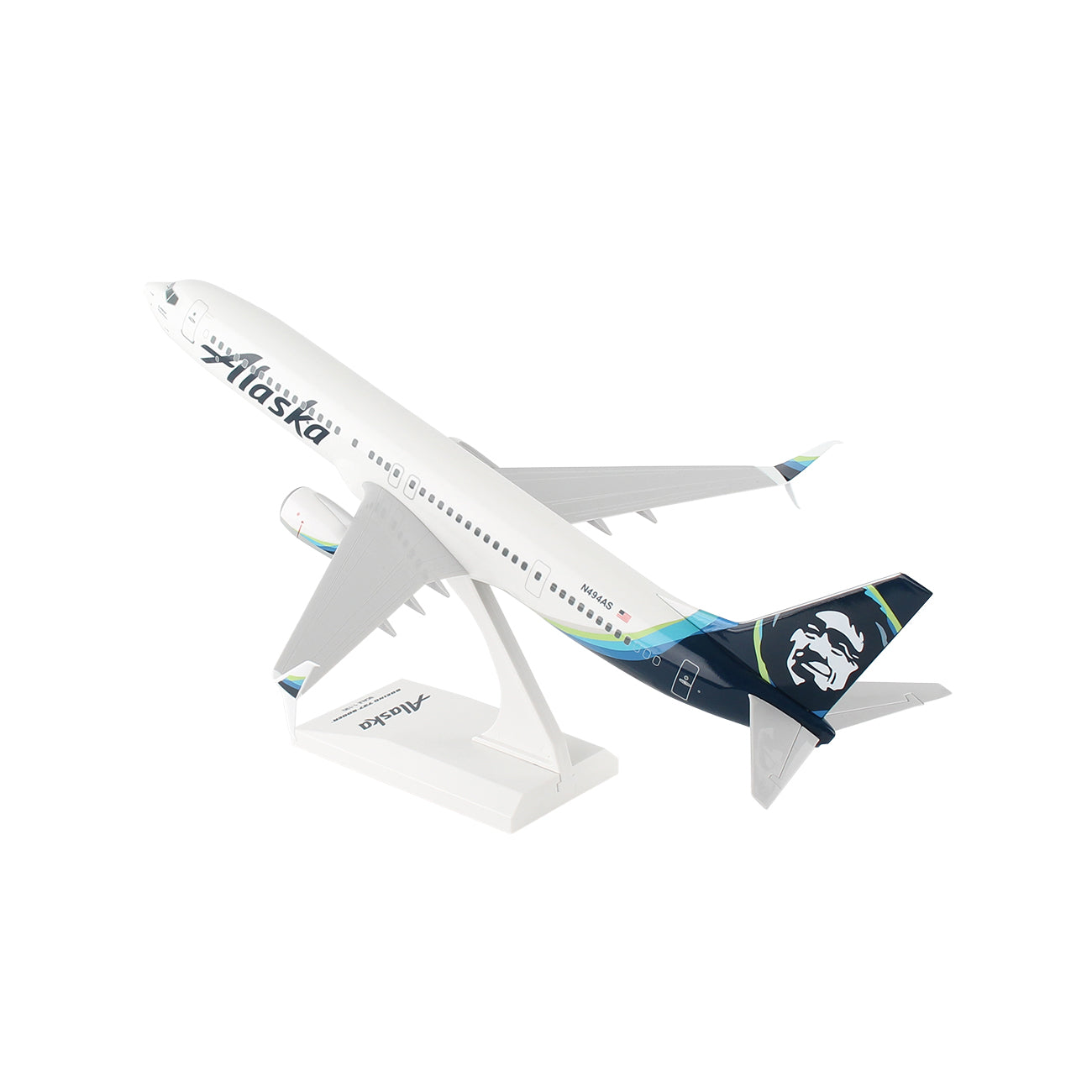 The Daron Alaska Airlines Boeing 737-900ER 1:130 Model features detailed Alaska livery, the airline’s logo on the tail, and comes mounted on a white stand, angled as if taking off—perfect for collectors.