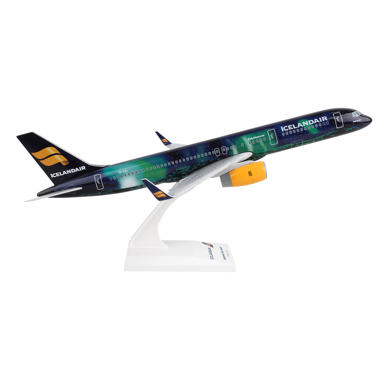 The Daron Icelandair Boeing 757-200 Hekla 1:150 Model features an injection molded plastic airplane in a takeoff position on a stand, adorned with a Northern Lights theme of green and blue shades, detailed landing gear, and prominently showing the companys logo on its tail and fuselage.