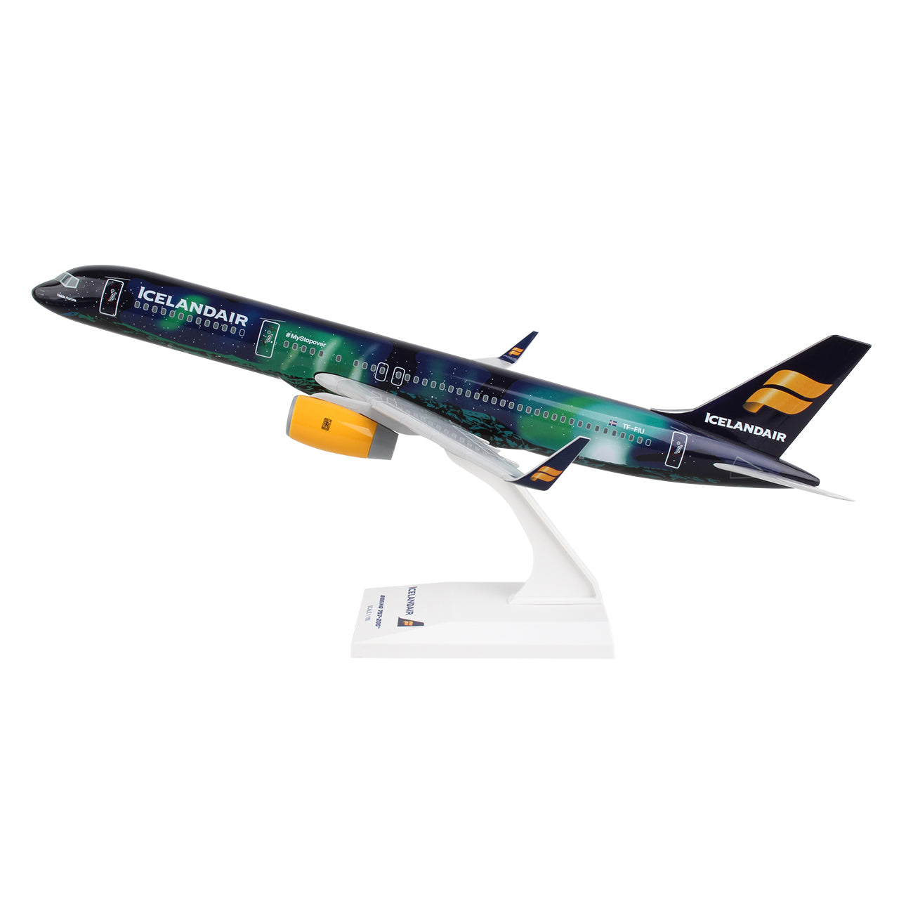 The Daron Icelandair Boeing 757-200 Hekla 1:150 model, made from injection molded plastic, elegantly sits on a display stand. It features branding on the fuselage and tail and showcases green and blue hues inspired by the Northern Lights livery.