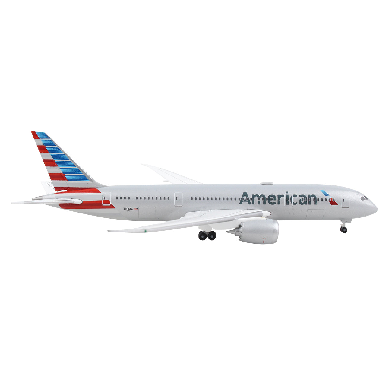 A side view of the Daron American Airlines Boeing 787-8 1:500 die-cast model shows a white body, tail with red, white, and blue stripes, American on the side, and detailed landing gear.