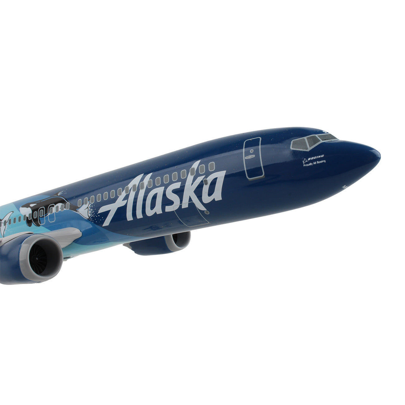 The Daron Alaska Airlines Orca Boeing 737 MAX 9 1:130 Model is ideal for collectors, featuring a sleek blue and teal livery with Alaska in white. The replica highlights its two engines and cockpit, though the wings and tail are not fully displayed.