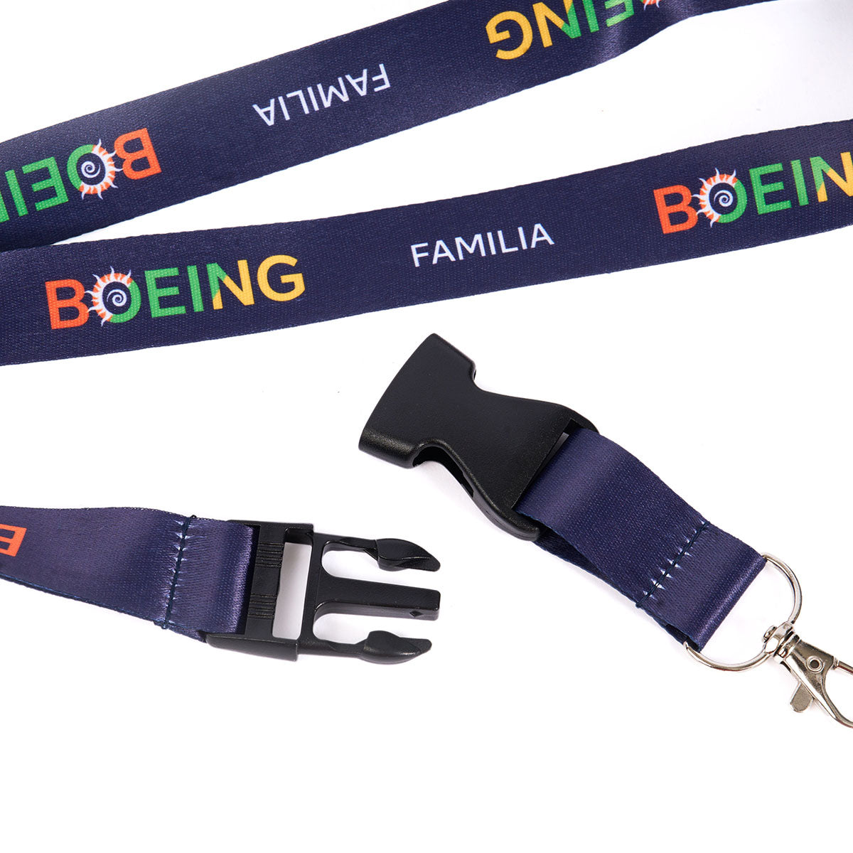 The Boeing Familia Lanyard by BOEING EXCLUSIVES features navy blue material, colorful "BOEING" and white "FAMILIA" lettering, an unclipped safety neck breakaway, a black plastic buckle, and metal detachable clasp.