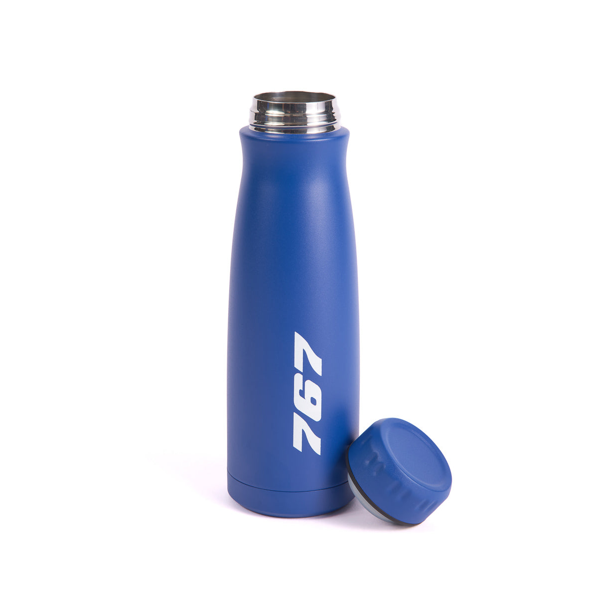 The blue Boeing 767 Stratotype Water Bottle by The Boeing Store features a sleek design with 767 in white, paying homage to aviation. It stands upright beside its unattached blue lid with a sophisticated curve.