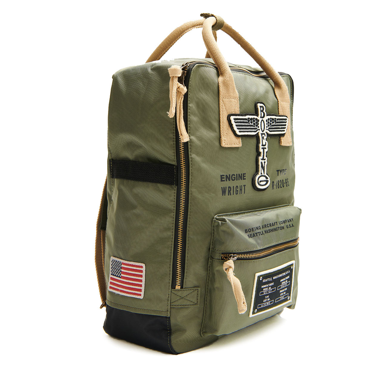 The Red Canoe Boeing Airplane Logo Backpack by The Boeing Store is a green backpack with beige handles and zippers. It features embroidered patches, including a winged logo, vintage Boeing logo, American flag patch, and text celebrating 20th century planes.