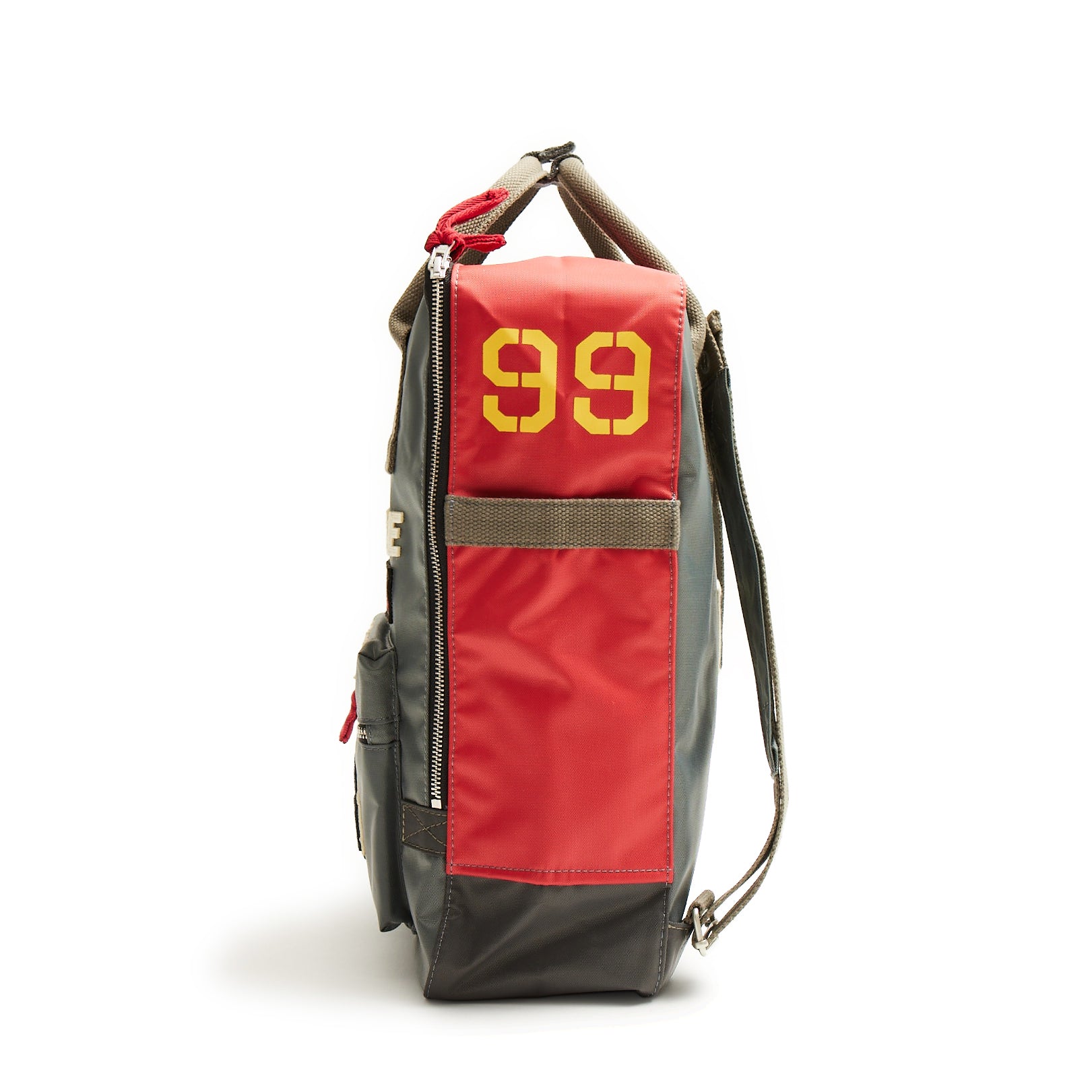 Introducing The Boeing Stores Red Canoe Boeing Tuskegee Red Tails Backpack: a stylish gray and red nylon design with a bold yellow 99 on the side. It features a zippered left pocket, adjustable shoulder straps for comfort, and a convenient top handle.