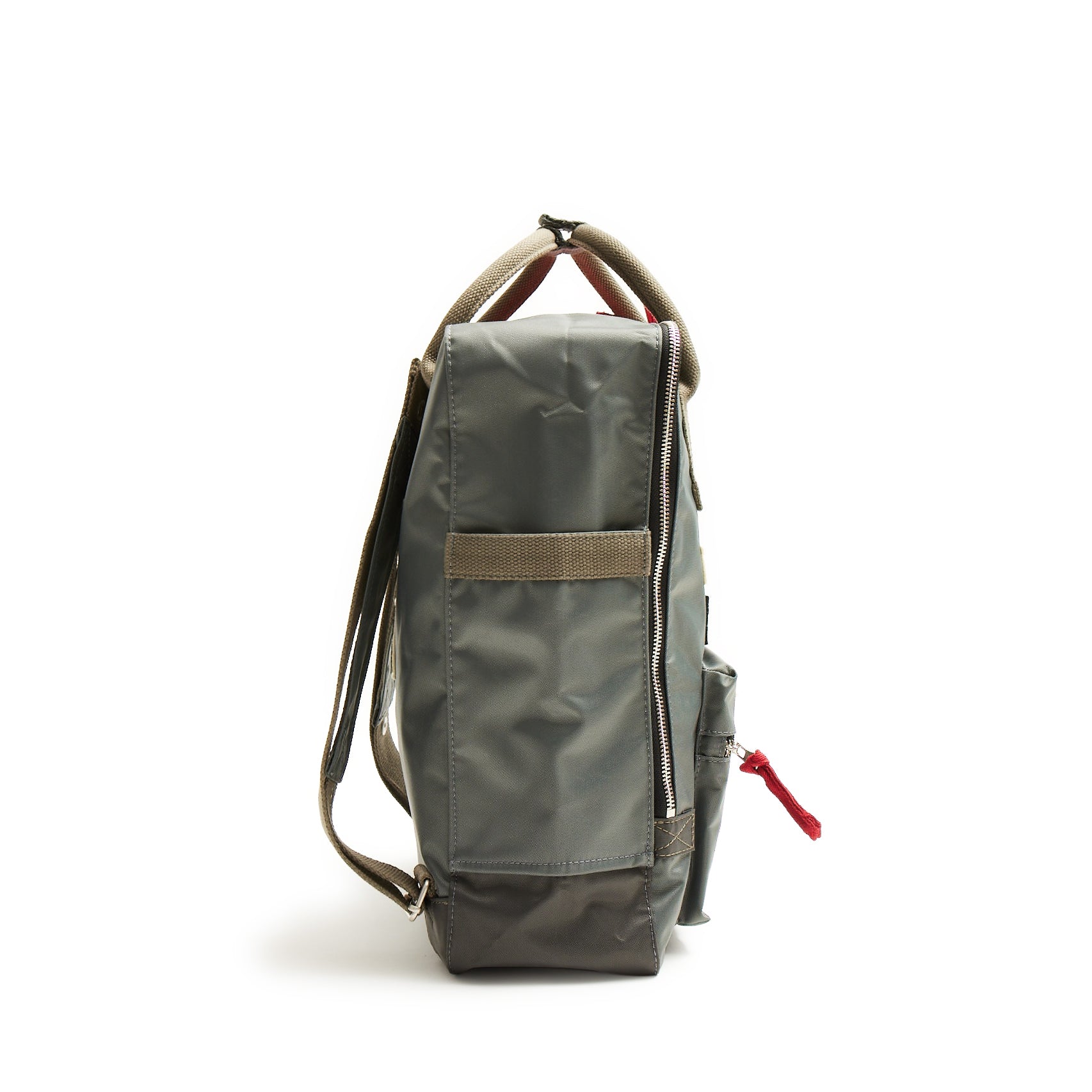 Side view of The Boeing Stores Red Canoe Boeing Tuskegee Red Tails Backpack in dark green nylon featuring a rectangular shape, light brown adjustable straps, and zippered compartments with a red zipper pull on a white background.