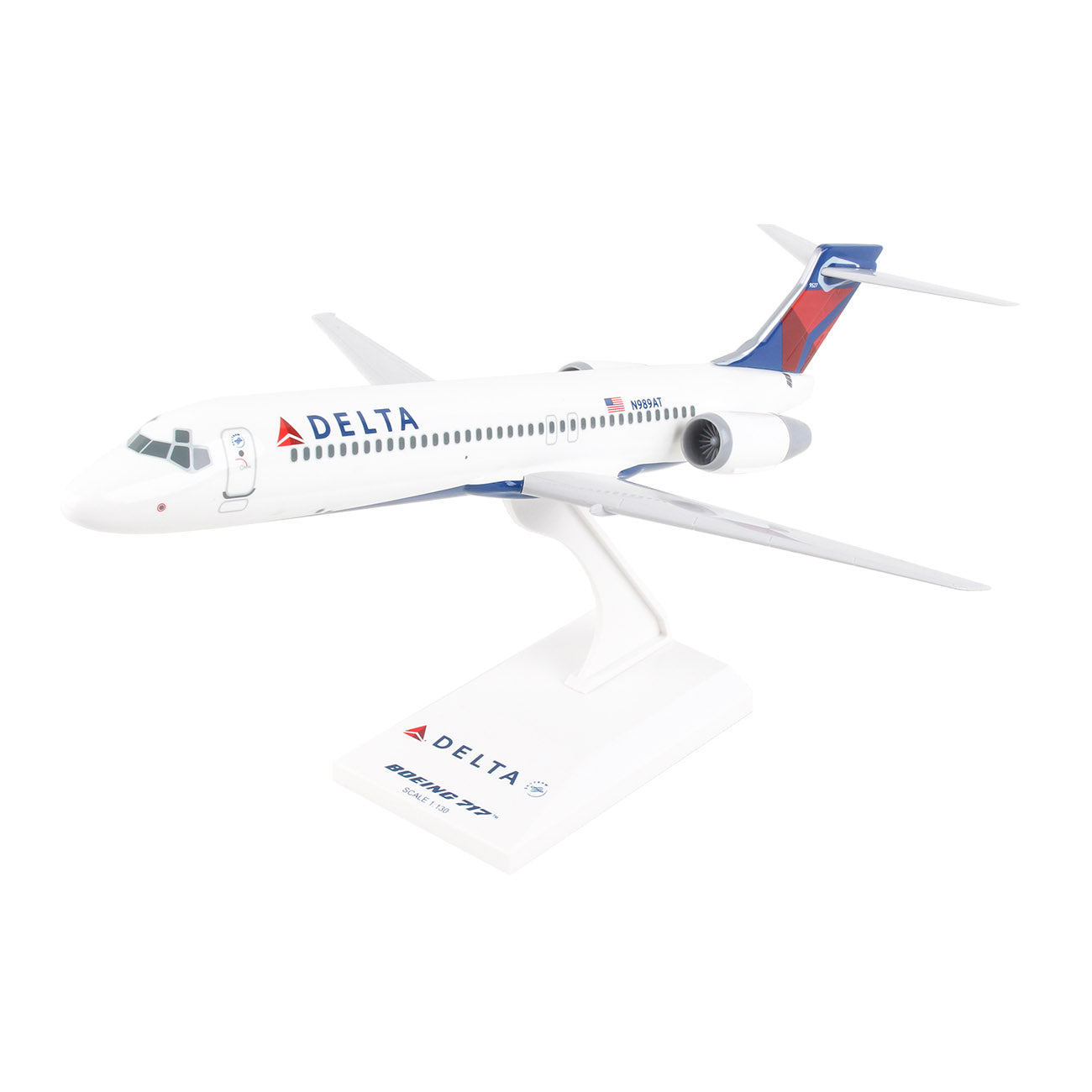 The Boeing Store presents the Delta Air Lines Boeing 717 1:130 Model, featuring white with red and blue accents, twin rear engines, and Delta in blue on the fuselage. It includes a display stand and is ready for assembly to enhance any aviation collection.