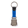 The Boeing Seat Belt Keychain from The Boeing Store features a mini seat belt buckle with the Boeing logo, a blue fabric strap, and a silver key ring—ideal for aviation enthusiasts seeking a unique engraved keychain.