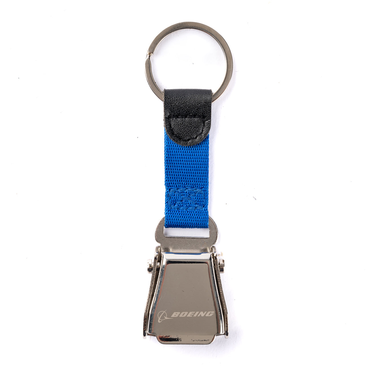The Boeing Seat Belt Keychain from The Boeing Store features a mini seat belt buckle with the Boeing logo, a blue fabric strap, and a silver key ring—ideal for aviation enthusiasts seeking a unique engraved keychain.