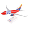 The Daron collectors model, titled Southwest Airlines Boeing 737-700 Tennessee One 1:130, features a red, blue and white design with a star on the fuselage and Southwest on the tail fin. It comes with a stand labeled Southwest Airlines.