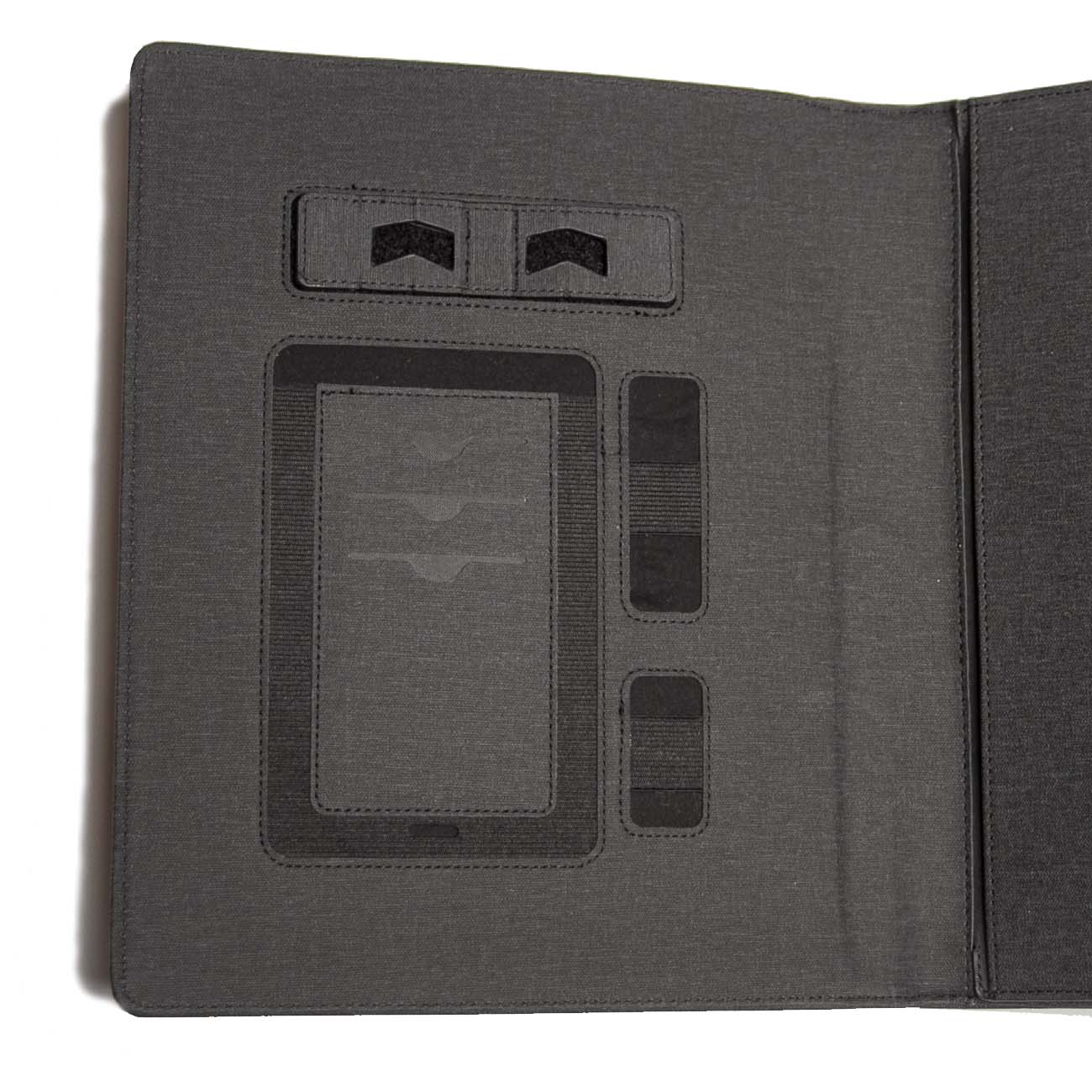 The open black Boeing Small Padfolio with Wireless Power Bank by The Boeing Store features multiple left-side compartments for cards and accessories, while the plain right side securely holds a tablet, designed for professional organization.