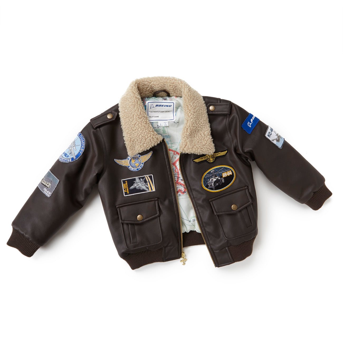The Boeing Stores Boeing Kids Brown Aviator Jacket features a shearling-fleece collar, aviation-themed patches on the front, sleeves, and shoulders, plus two front pockets.