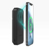 The Mophie Boeing Snap+ Power Station by The Boeing Store wirelessly charges a smartphone, indicated by green glowing rings on the phones screen. Both devices are set at an angle on a plain white background.