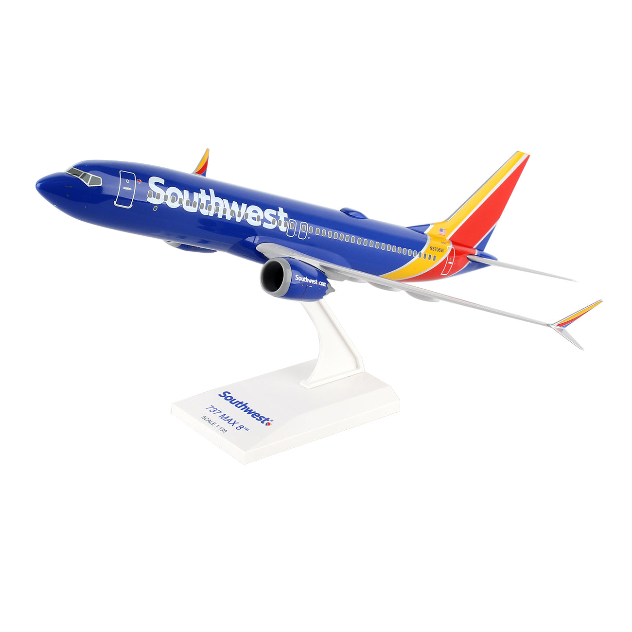 The Daron Southwest Airlines Boeing 737 MAX 8 1:130 Model is an injection molded plastic airplane designed for collectors, featuring a blue fuselage with the Southwest logo, a vivid red, yellow, and orange tail, and elegantly displayed on a white stand labeled with its model name.